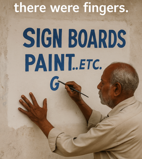 An elderly Indian sign painter with brushes and paints, creating a traditional hand-lettered shop sign on wood.